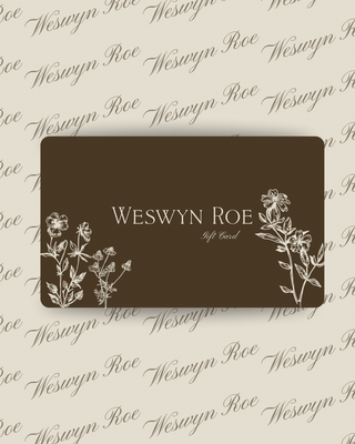 Weswyn Roe gift card with floral designs on a patterned background