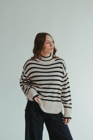 1.	“Oversized cream and black striped mock neck sweater for women”
	2.	“Cozy striped knit pullover in cream and black”
	3.	“Women’s oversized striped sweater, cream and black, mock neck”
	4.	“Casual chic black and cream striped knit sweater”