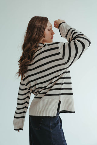 1.	“Oversized cream and black striped mock neck sweater for women”
	2.	“Cozy striped knit pullover in cream and black”
	3.	“Women’s oversized striped sweater, cream and black, mock neck”
	4.	“Casual chic black and cream striped knit sweater”
